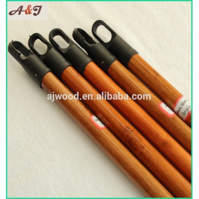 varnished wooden broom handle with long hanger